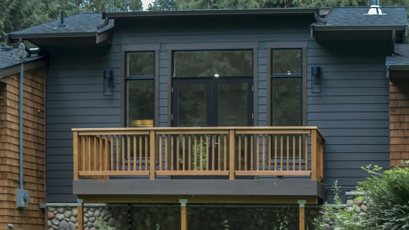 Wood deck, railing and windows viewed from outside